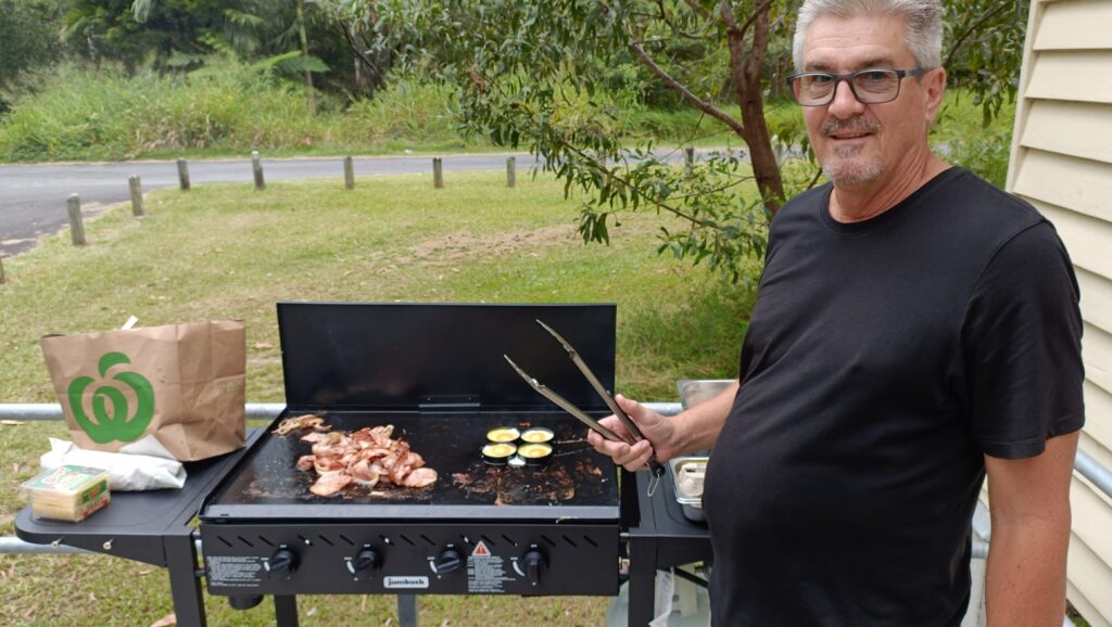 President Geoff cooking breakfast for us