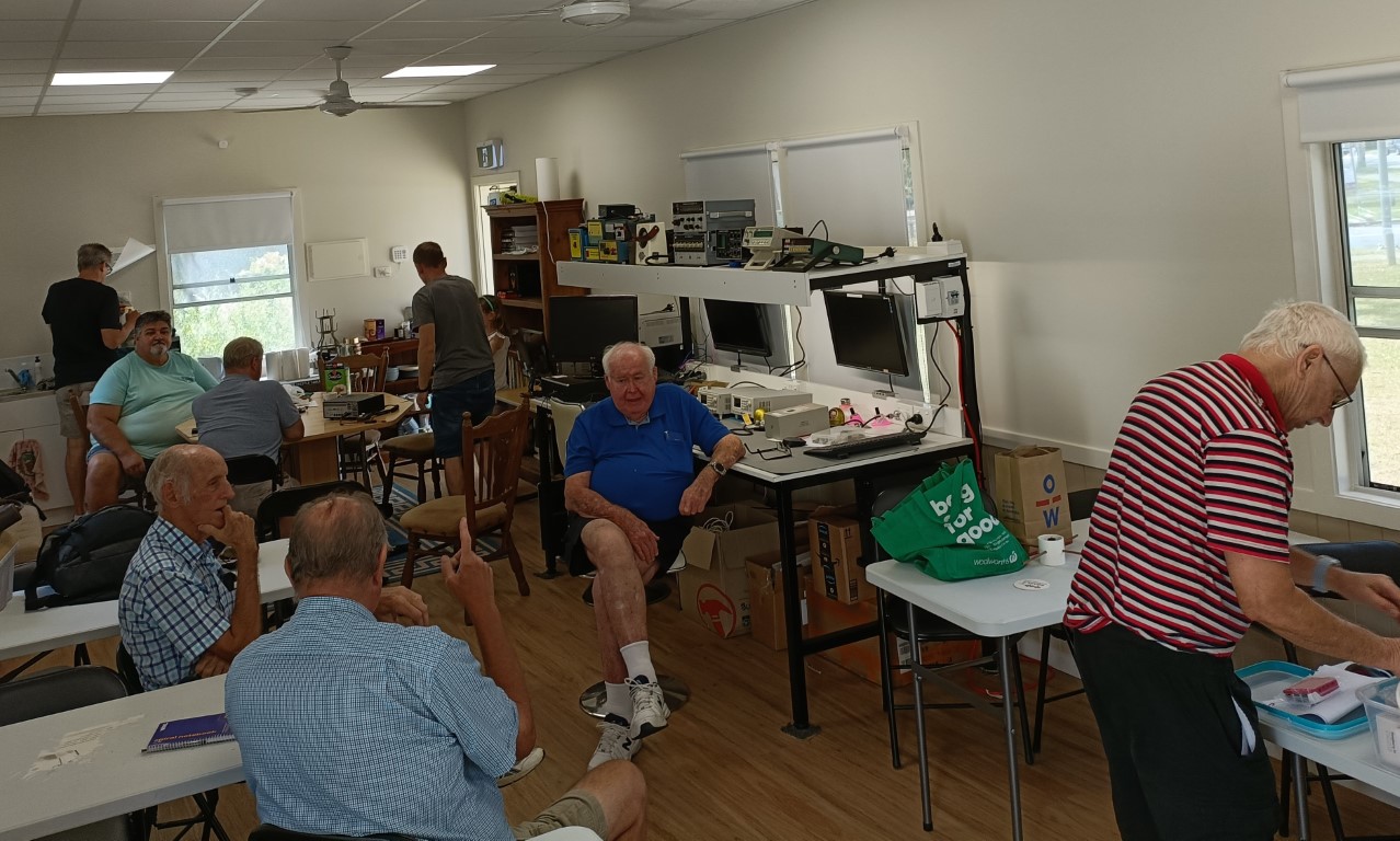 Inside clubhouse showing lots of people and activity