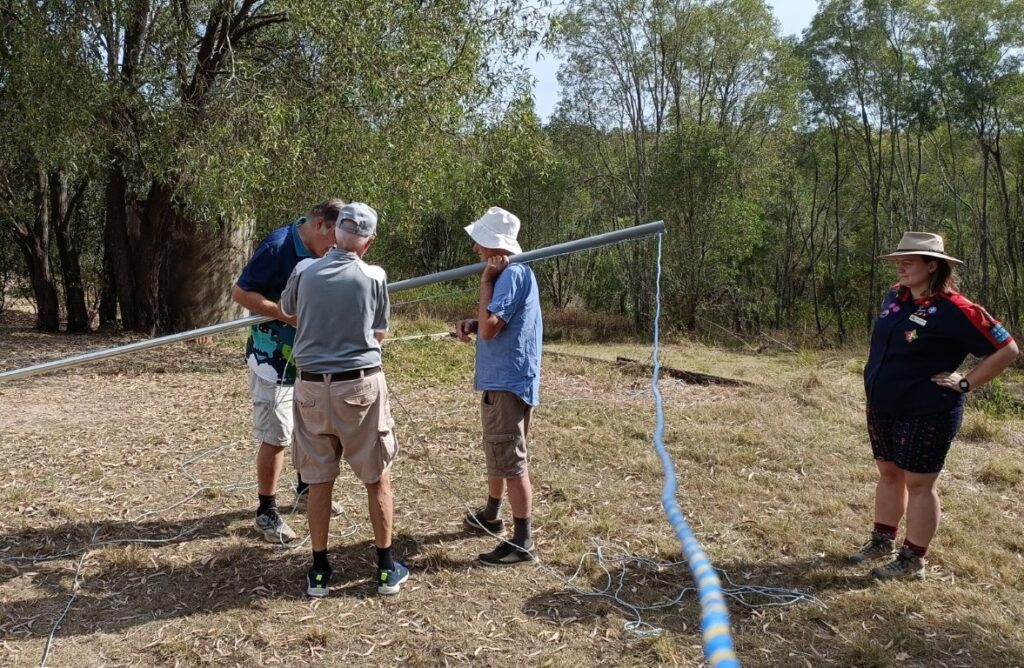 The team erecting one of the dipole support poles