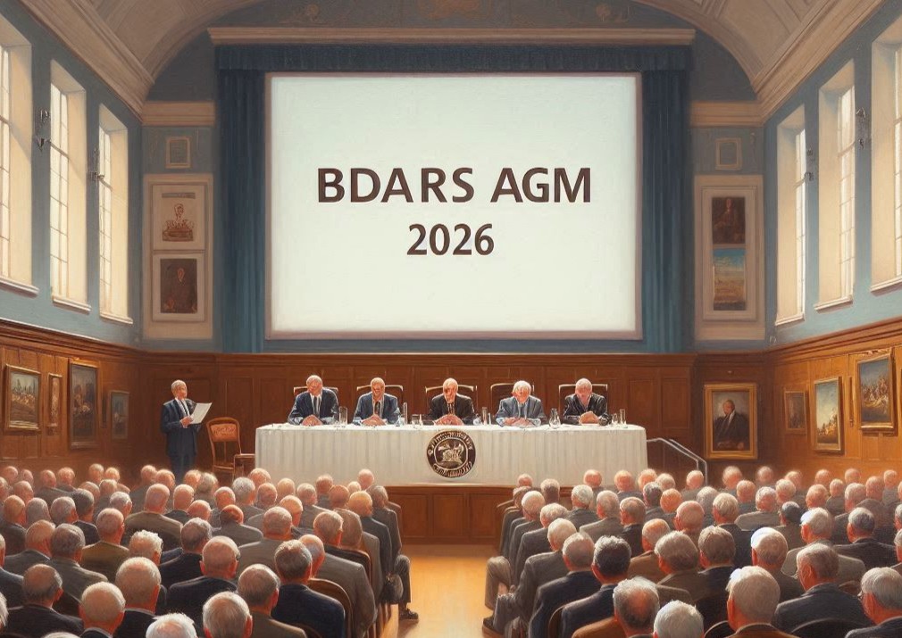 meeting hall with AGM in progress, members seated facing the top-table